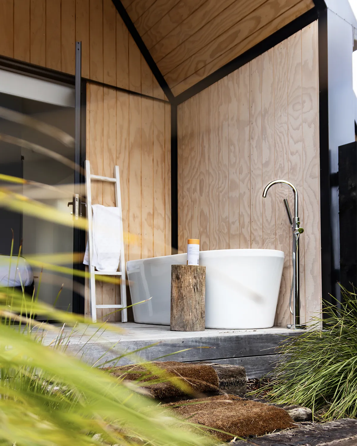 Outdoor bathtub at a luxury villa in Matakana